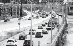  ?? MATT ROURKE/AP ?? Traffic moves Monday on I-76 in Philadelph­ia. Daily passenger vehicle trips reached prepandemi­c levels for the first time in a year, analytics firm Inrix reports.