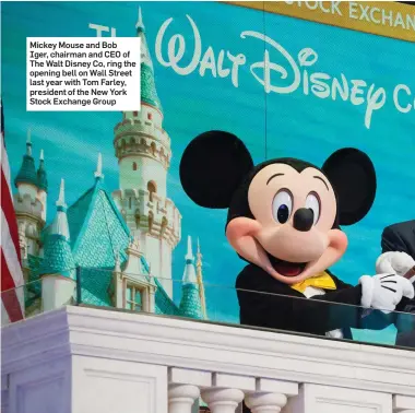  ??  ?? Mickey Mouse and Bob Iger, chairman and CEO of The Walt Disney Co, ring the opening bell on Wall Street last year with Tom Farley, president of the New York Stock Exchange Group