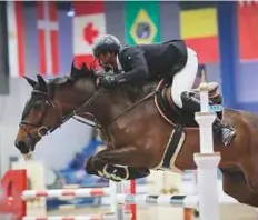  ?? Photo Organisers ?? Action from the HH Sharjah Ruler Cup. The CSI5*W event carries a total of Dh4.1 million in prize money.