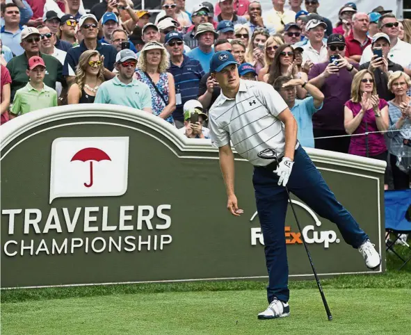  ?? – AP ?? Let it go: Jordan Spieth watching his drive from the first tee at the Travelers Championsh­ip at TPC River Highlands on Wednesday.