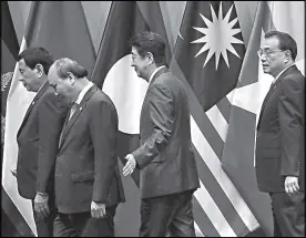  ?? EPA ?? President Duterte, Vietnam’s Prime Minister Nguyen Xuan Phuc, Japan’s Prime Minister Shinzo Abe and Chinese Premier Li Keqiang leave the stage after a group photograph during the 21st Asean Plus Three summit at the 33rd Associatio­n of Southeast Asian Nations summit in Singapore on Thursday.