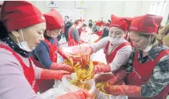  ?? AP ?? Making kimchi, a vegetable dish, in Seoul. While most people born in rich countries will live longer by 2030, women in S Korea are projected to reach nearly 91, a study predicts.