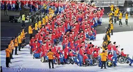  ??  ?? Full dress: Malaysian Asean Para Games Team marching during the opening ceremony of the Kuala Lumpur Asean Para Games 2017 at National Stadium Bukit Jalil.