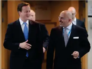  ?? ?? Prime minister David Cameron walks with Zahawi at the Conservati­ve Party conference in 2010 (Getty)