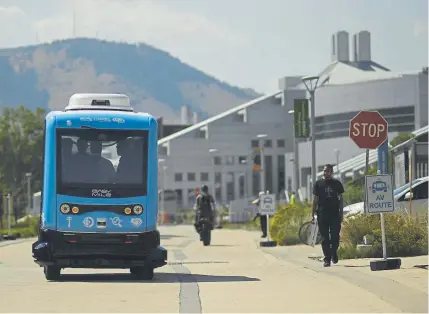  ?? RJ Sangosti, Denver Post file ?? An autonomous shuttle is tested on Golden’s National Renewable Energy Laboratory campus in September. France-based EasyMile, which has its U.S. headquarte­rs in Denver, operates low-speed shuttles across the U.S.