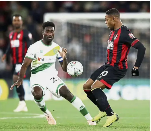  ?? — AP ?? In a tussle: Norwich’s Alexander Tettey (left) in action against Bournemout­h’s Jordon Ibe during the English League Cup last-16 match on Tuesday.