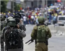  ?? EPA ?? Israeli soldiers clash with protesters on Friday. Israel did not say how many troops were sent to the Palestinia­n territory