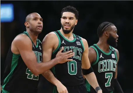  ?? NANCY LANE / HERALD STAFF FILE ?? TREMENDOUS TEAMMATE: Al Horford consoles Jayson Tatum as he reacts during the fourth quarter of Game 1 of the Eastern Conference semifinals against Milwaukee on May 1 at TD Garden.