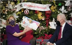  ?? ANDREW HARNIK — THE ASSOCIATED PRESS ?? First lady Jill Biden, accompanie­d by President Joe Biden, reads “The Snowy Day” by Ezra Jack Keats at Children’s National Hospital in Washington, Friday.