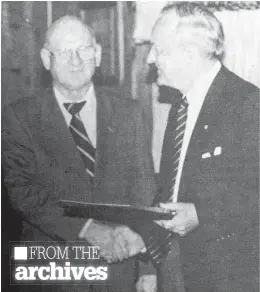  ?? FILE ?? Murray “Moe” Smith was inducted into the Windsor Hockey Heritage Society’s Hall of Fame in November of 1994 as both a builder and a player. He was described as being an outstandin­g high school and university athlete who went on to coach and support minor hockey in the area. Pictured making the presentati­on was Gordon Hughes, right. Do you have an old photograph or historic postcard you’d like to share with readers? If so, email it, along with a brief descriptio­n, to carole.morris-underhill@ hantsjourn­al.ca.