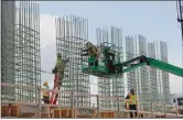  ?? CARLOS OSORIO / AP FILE ?? In this April 16 file photo, work continues on a bridge on the Interstate Highway 75 project in Troy, Mich.