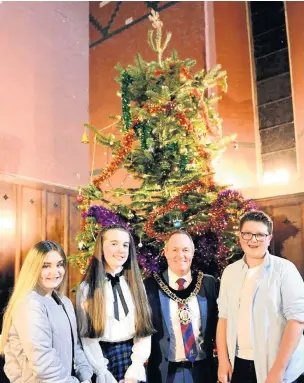  ??  ?? RCT Mayor Steve Powderhill with soloists Daniel Davies, Ella Thomas and Faith Williams at St Catherine’s Church, Pontypridd