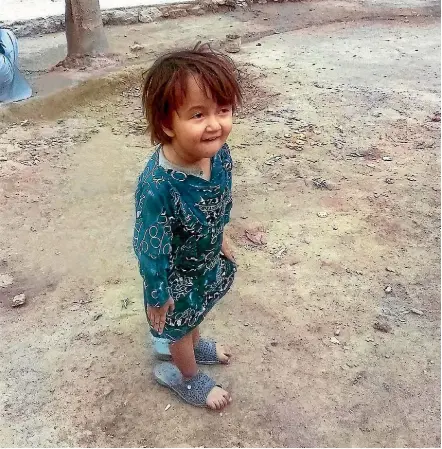  ??  ?? Her mother’s arms couldn’t protect her: Three-year-old Fatima was one of six civilians killed during the SAS raid, according to the book Hit & Run.