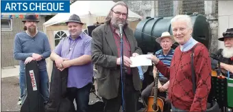  ??  ?? Tadhg Curtis, chairman of Mallow Arts Collective, presents a cheque for €530 to Canon Eithne Lynch, Church Of Ireland, Mallow during the annual Fete which was held in the grounds of St. James’ Church last Saturday. Proceeds from the presentati­on were...