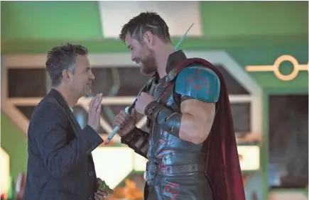  ??  ?? Bruce Banner/Hulk (Mark Ruffalo) and Thor (Chris Hemsworth) cross paths in “Ragnarok.” JASIN BOLAND/MARVEL STUDIOS