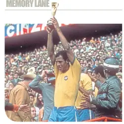  ??  ?? Carlos Alberto raises the World Cup inside the Azteca Stadium