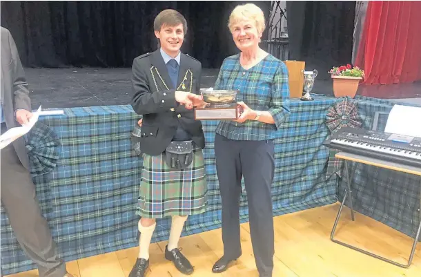  ?? ?? SILVER LINING: Provost McDade presents the May Mitchell and Frances Matheson Quaich to Aberfeldy Gaelic Choir musical director May Brown.