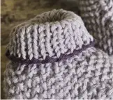  ??  ?? Create a contrast edge on your moss stitch bootee by casting off in Yarn B.