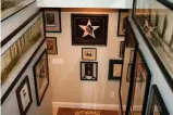  ??  ?? Stairwells are an excellent area to display large flat items like maps, posters and photograph­s, suitably framed