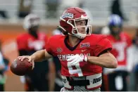  ?? (AP Photo/butch Dill) ?? National quarterbac­k Jake Haener of Fresno State throws a pass Thursday during practice for the Senior Bowl NCAA college football game in Mobile, Ala..