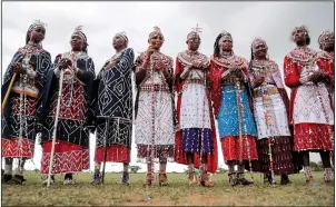  ?? ?? Maasai women spectators watch the Maasai Olympics.