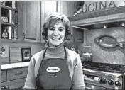  ?? BUTTERBALL ?? Aurora resident Phyllis Kramer stands in her kitchen while taking a call for the Butterball Turkey Talk-Line.