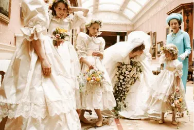  ??  ?? ABOVE: Diana and her attendants on her wedding day, July 29, 1981. Diana’s dress, made of ivory taffeta and antique lace with sequins and pearls, featured a 25-foot-long train. BELOW: Diana and Prince Charles photograph­ed on their honeymoon at Balmoral...