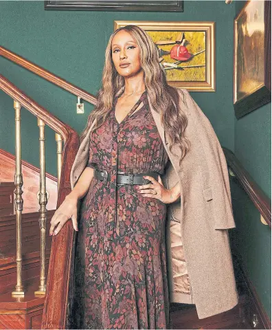  ?? GIONCARLO VA L E N T I N E THE NEW YORK TIMES ?? Iman, wearing Ralph Lauren, at the Polo Bar in Manhattan. The supermodel talks about life after David Bowie, their Catskills refuge and the perfume inspired by their love.