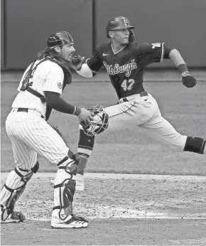  ?? GETTY IMAGES ?? Erik Gonzalez scored a questionab­le run in the fifth inning Sunday.