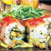  ?? SUSHI GARAGE ?? The tuna chicharrón roll, built with crispy tuna skin, is on the menu at Sushi Garage.