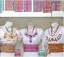  ??  ?? View of Puruha-style hand-embroidere­d blouses at a store in Riobamba, Ecuador.