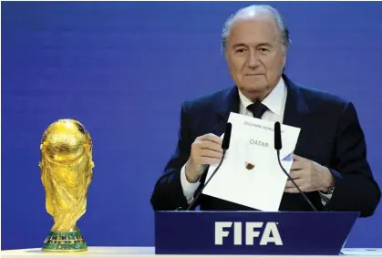  ?? ?? Fifa president Sepp Blatter announces Qatar as the 2022 World Cup host country in 2010. Photograph: Philippe Desmazes/AFP/Getty Images