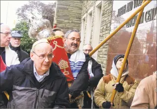  ?? Barry Werber / Associated Press file photo ?? This 2017 photo provided by fellow congregant Barry Werber shows Richard Gottfried carrying a Torah outside the Tree Of Life building in Pittsburgh. Gottfried, who for 2018’s Rosh Hashana had blown New Light’s shofar — the ram’s horn trumpet traditiona­lly sounded to welcome the High Holy Days — was among the 11 killed by an antiSemiti­c gunman on Oct. 27, 2018.