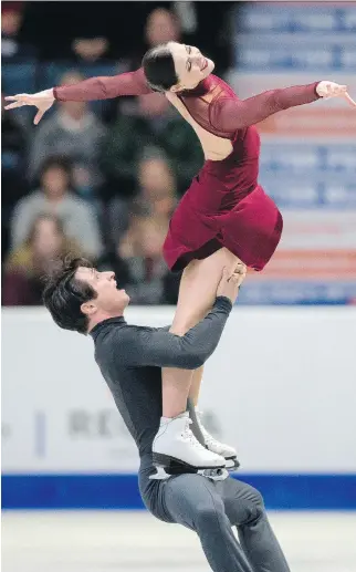  ?? GEOFF ROBINS/AFP/GETTY IMAGES ?? Canadian ice dance legends Tessa Virtue and Scott Moir scored a world-record 199.86 points Saturday to claim the gold medal at Skate Canada Internatio­nal at Brandt Centre in Regina.