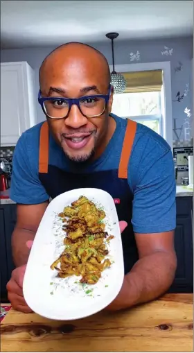  ?? COURTESY EVAN MARTIN ?? Fitchburg native and current Leominster resident Evan Martin shows off crispy air-fried artichokes with homemade ranch.