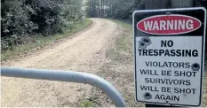  ?? MICHAEL KUNZELMAN/THE ASSOCIATED PRESS ?? The entrance to suspected serial killer Ryan Sharpe’s home is shown seen Clinton, La. Sharpe was charged in the killing of three people and the wounding of another in a string of attacks that started in July.