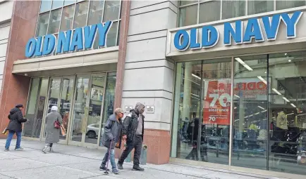  ?? MICHAEL M. SANTIAGO/GETTY IMAGES ?? People walk past an Old Navy store on Fulton Street on April 11 in downtown Brooklyn in New York. The rise in consumer spending has been driven by an increase in spending on health care and financial services. Purchases of goods declined.