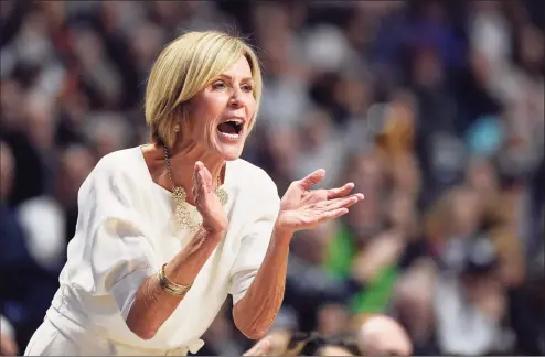  ?? Jessica Hill / Associated Press ?? UConn associate head coach Chris Dailey calls to her team in the first half against Oklahoma during a 2019 game in Uncasville.