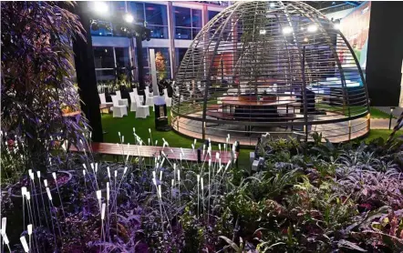  ?? — AFP ?? Safety is a necessity: A view of the Connect@Changi courtyard, and (below) a meeting room installed with glass divider, billed as the world’s first coronaviru­s-safe hotel and conference complex, in Singapore.