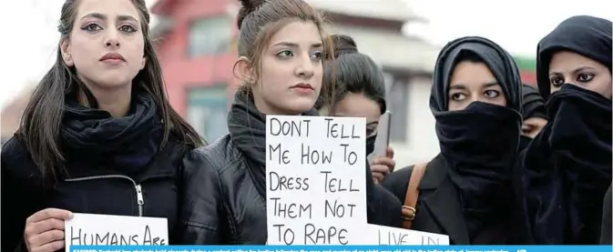  ?? —AFP ?? KASHMIR: Kashmiri law students hold placards during a protest calling for justice following the rape and murder of an eight-year-old girl in the Indian state of Jammu yesterday.