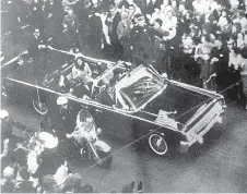  ?? Warren Commission via AP ?? This image provided by the Warren Commission is an overhead view of President John F. Kennedy's car in a Dallas motorcade on Nov. 22, 1963, and was the commission's Exhibit No. 698. Special agent Clinton J. Hill is shown riding atop the rear of the...