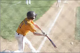  ?? Photo by Becky Polaski ?? Lance O’Neill is shown connecting with a pitch in the bottom of the fourth inning. O’Neill reached base on an error on the play, and teammate Matthew Gilmore scored to give the Crusaders a 5-2 lead.