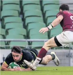  ??  ?? Helping hand: Jacob Stockdale’s pass set up the chance for Hugo Keenan to dive over to score against Georgia last weekend