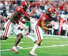  ?? THE ASSOCIATED PRESS ?? Oklahoma linebacker Caleb Kelly (19), shown scoring on a fumble return in the Big 12 title game earlier this month, believes the Sooners don’t get noticed defensivel­y unless they’re struggling.