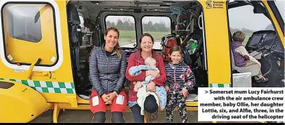  ?? ?? > Somerset mum Lucy Fairhurst
with the air ambulance crew member, baby Ollie, her daughter Lottie, six, and Alfie, three, in the
driving seat of the helicopter