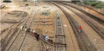  ?? -Reuters ?? COMMITTED: Labourers from the Pakistan Railways are seen working on railway tracks along City Station in Karachi, Pakistan.