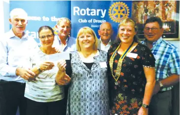  ??  ?? Gathered after the cheque presentati­on are (back row, from left) organising committeem­embers Rotarians Don Kelly, Bill Petschack, Peter Williams and Glynn Fankhauser; (front row) Maryann Bills, Sue McDermott and club president Sharryn Marshall.