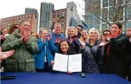  ?? DAVID L RYAN/GLOBE STAFF ?? Mayor Michelle Wu signed her order creating a new planning department under the purview of City Hall Tuesday.