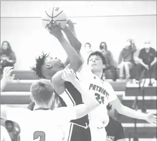  ?? Fred Conley • Times-Herald ?? Palestine-Wheatley's Kyle Wright (21) defends in a recently played varsity boys game at the gym in Palestine. The Patriots held off DeWitt 37-35 in a game played Friday at DeWitt. With the win, P-W improves to 8-9 overall and 4-4 in the 3A-6 conference, keeping the Patriots in fifth place. Aviean Smith led the Patriots with nine points. In the varsity girls game played Friday, DeWitt defeated the P-W Lady Patriots 59-46 dropping P-W to 6-12 overall and 3-6 in the conference. Gentry Bass led P-W with 13 points while Hannah Lewis had nine. Palestine-Wheatley will be on the road again Tuesday at Pine Bluff Dollarway. In games played Friday at Mustang Arena, Pulaski Academy swept the Forrest City conference doublehead­er. The PA Bruins defeated Forrest City 72-59 in the varsity boys game and won the girls game as well, 65-21. Forrest City will host Pulaski Robinson Tuesday in the final game of the current five-game home stand.