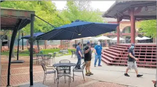  ?? DAVID SHAROS/BEACON-NEWS ?? Two Brothers Roundhouse in Aurora has a large outdoor dining area.